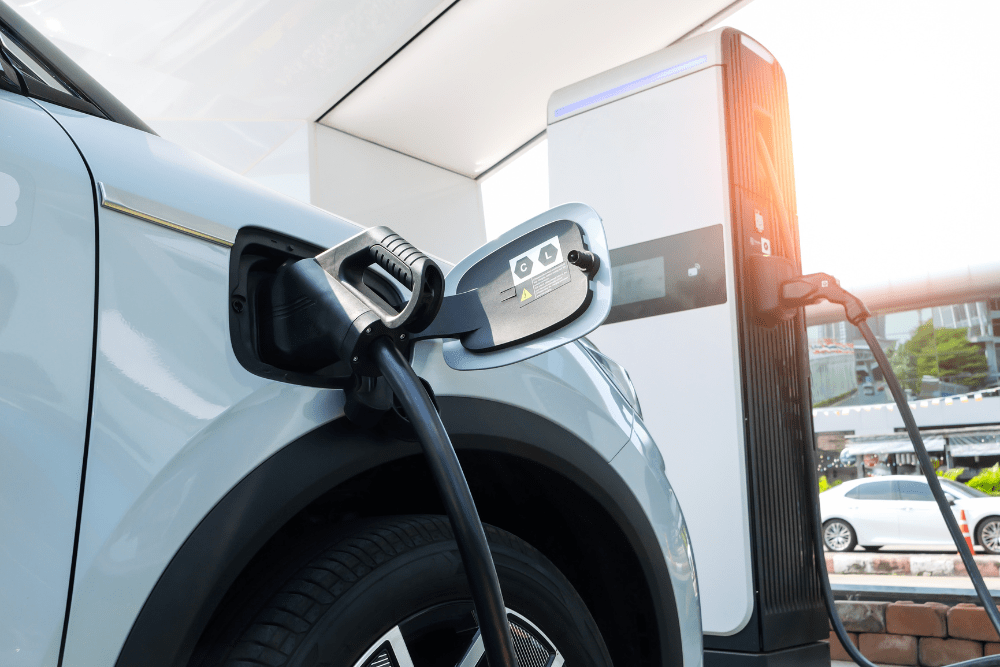 electric vehicle maintenance, auto repair in Sheboygan, WI at NexGen Automotive. Electric vehicle plugged into a charging station.