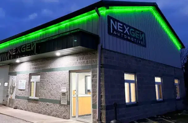 NexGen Automotive's exterior covered in snow during winter.